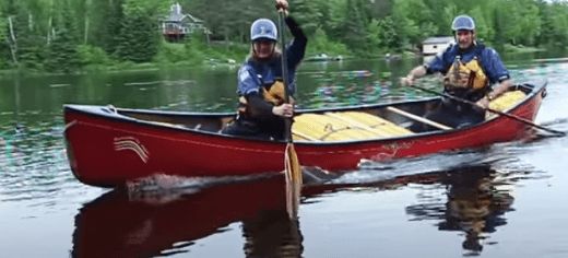 A photo of a canoe in moving water.